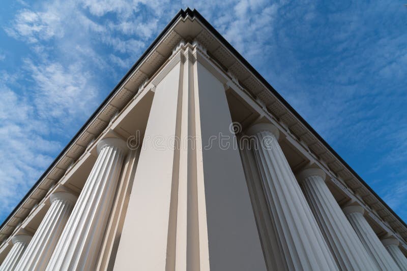 Low point of view of building corner and classic Roman columns