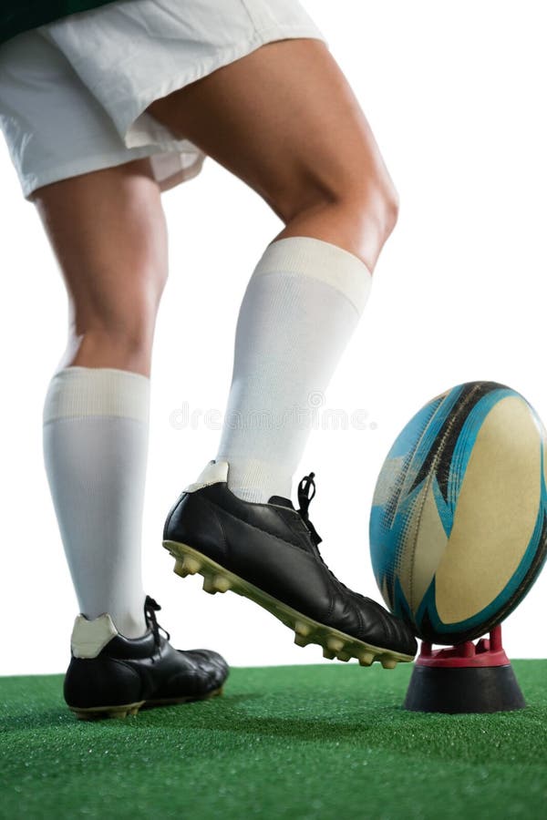 Low Section of Female Rugby Player Kicking Ball on Tee Stock Image