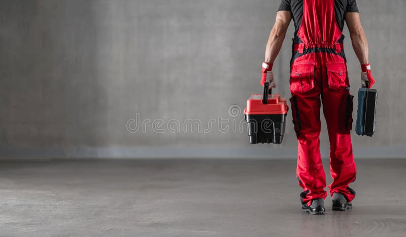 Professional Caucasian Worker with Toolboxes in His Hands stock photography