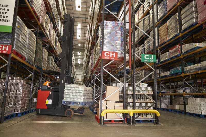 Lowering stock in a distribution warehouse using aisle truck