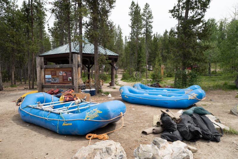 Lowman, Idaho - July 1, 2019: Whitewater Rafting groups prepare to launch a raft for a river rafting trip down the ramp for a trip in the Middle Fork of the Salmon River during summer. Lowman, Idaho - July 1, 2019: Whitewater Rafting groups prepare to launch a raft for a river rafting trip down the ramp for a trip in the Middle Fork of the Salmon River during summer