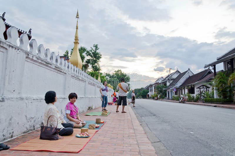 LUANG PRABANG, LAO - MAY 12:Tourist waiting for the monks. Every