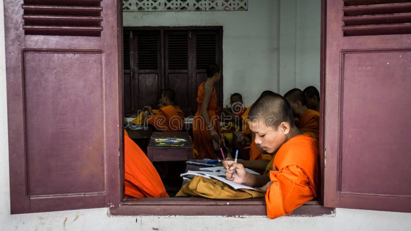 Luang Prabang, Laos - December 3, 2015: Student monks at school stock images Luang Prabang, Laos - December 3, 2015: Student monks at school stock images