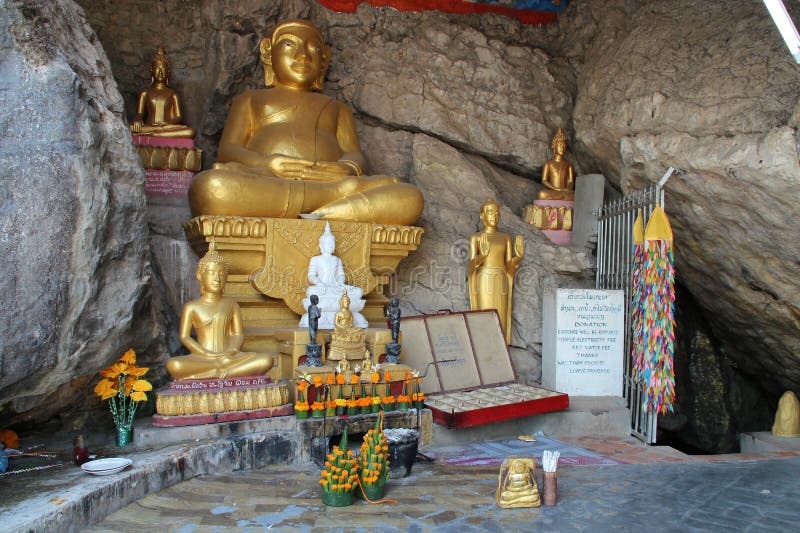 altar and statues of buddhist divinities at mount phou si in luang prabang in laos. altar and statues of buddhist divinities at mount phou si in luang prabang in laos