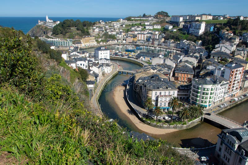 LUARCA, SPAIN - MARCH 06, 2024:.View of the port and town from the Ermita de San Roque y San Martin chapel viewpoint Luarca,Valdes,Asturias,Spain. LUARCA, SPAIN - MARCH 06, 2024:.View of the port and town from the Ermita de San Roque y San Martin chapel viewpoint Luarca,Valdes,Asturias,Spain