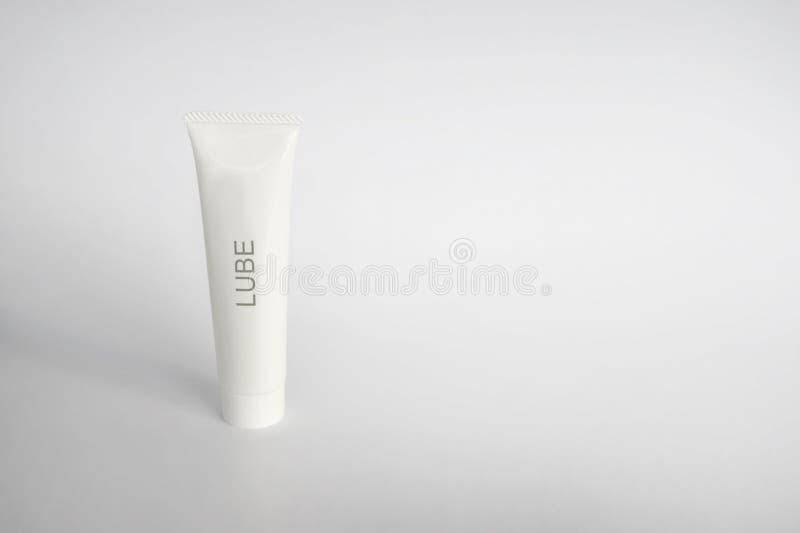A white plastic tube of generic lubricant, with the word lube printed on the front. The photo has the tube standing off-centered on the left side with sufficient white space for text on the right, and is set on a white background. This photo can be used for industrial, personal, or artistic/creative marketing purposes. A white plastic tube of generic lubricant, with the word lube printed on the front. The photo has the tube standing off-centered on the left side with sufficient white space for text on the right, and is set on a white background. This photo can be used for industrial, personal, or artistic/creative marketing purposes.