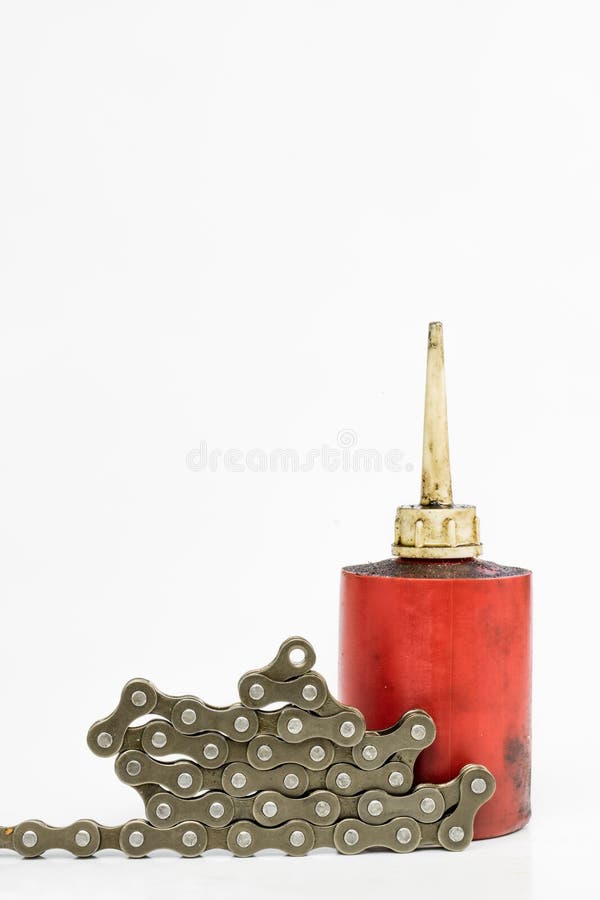 Lubricante de la cadena de la bicicleta con el lubricante líquido SE periódico imagen de archivo Lubricante de la cadena de la bicicleta con el lubricante líquido SE periódico imagen de archivo