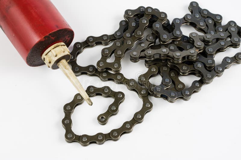 Lubricante de la cadena de la bicicleta con el lubricante líquido SE periódico fotos de archivo Lubricante de la cadena de la bicicleta con el lubricante líquido SE periódico fotos de archivo