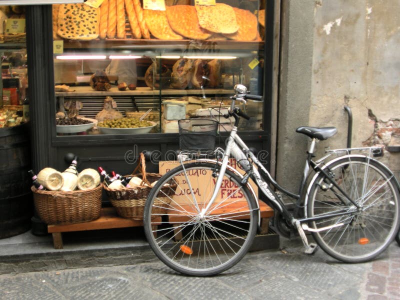 Lucca Tuscany charming street in a tourist town Italy Sanfrediano travel Italian towns scenic destinations travelitaly via fillungo with a bicycle outside the bread shop. Lucca Tuscany charming street in a tourist town Italy Sanfrediano travel Italian towns scenic destinations travelitaly via fillungo with a bicycle outside the bread shop