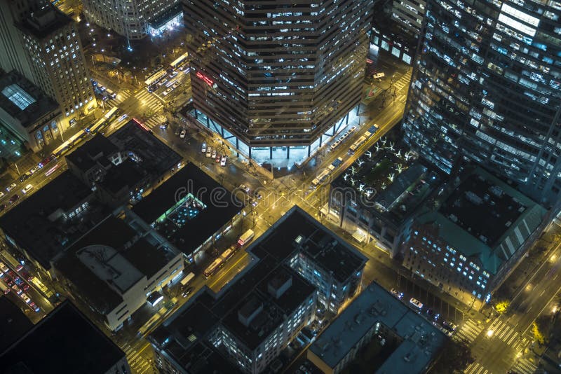 Overhead view of neon city lights at intersection. Overhead view of neon city lights at intersection