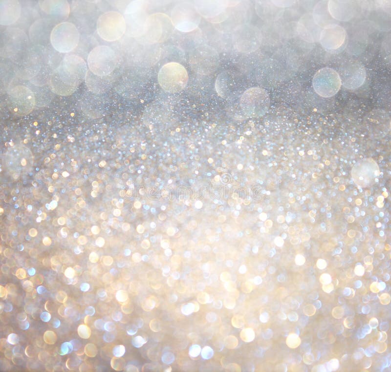 Luci astratte bianche del bokeh dell'oro e dell'argento. fondo defocused fotografia stock libera da diritti