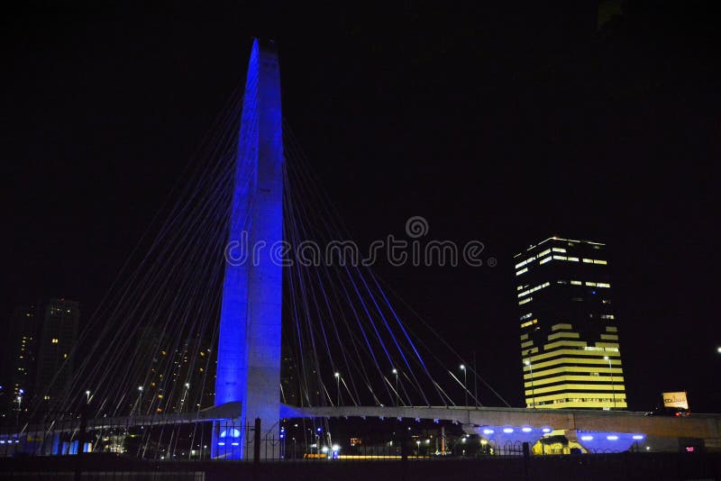 S�o Jos� dos Campos, April 5, 2024: The beautiful view of the lights of the Colinas Green Tower and the Juana Blanco Arch of Innovation cable-stayed bridge. S�o Jos� dos Campos, April 5, 2024: The beautiful view of the lights of the Colinas Green Tower and the Juana Blanco Arch of Innovation cable-stayed bridge