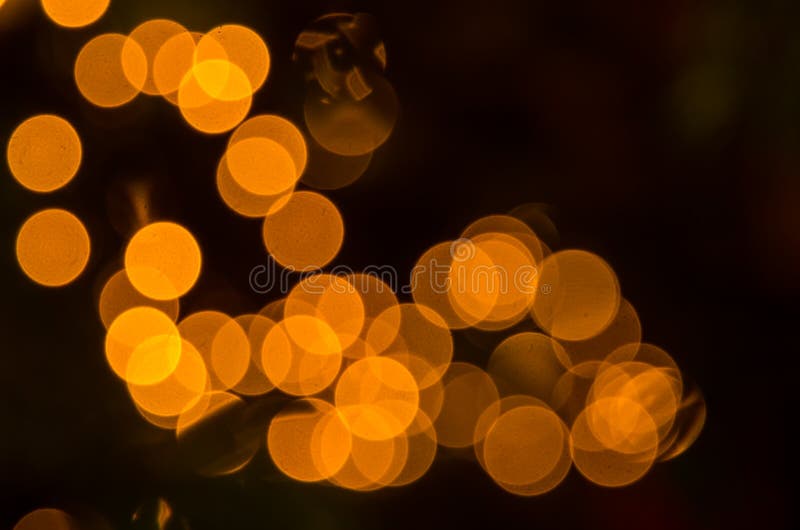 Luci di natale colorate in oro astratte fotografia stock libera da diritti Luci di natale colorate in oro astratte fotografia stock libera da diritti