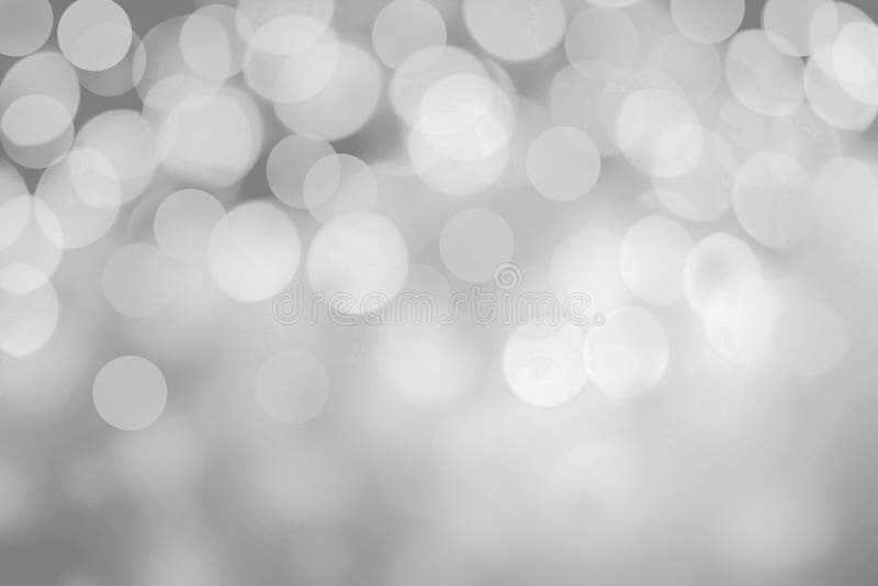 Luci scintillanti su fondo grigio estratto di natale di scintillio fotografia stock Luci scintillanti su fondo grigio estratto di natale di scintillio fotografia stock
