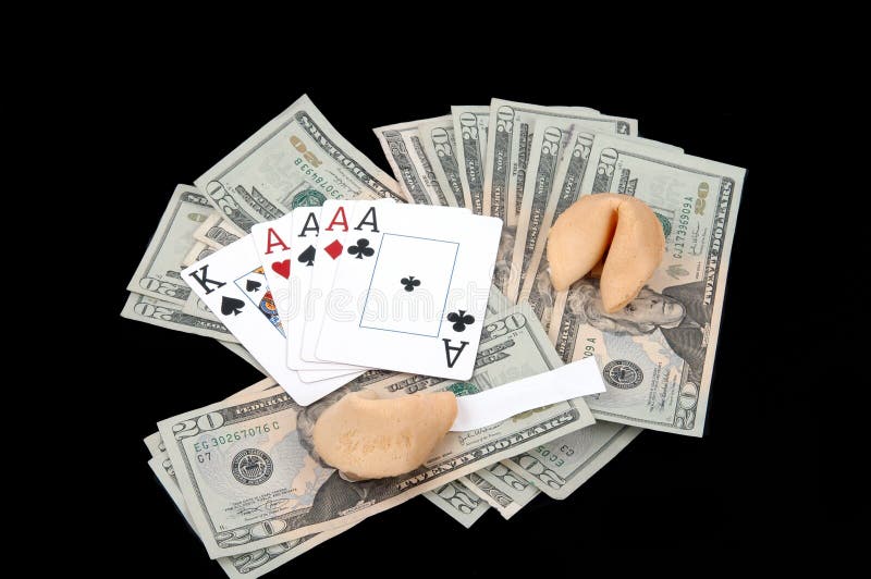 Fortune cookies with a blank message and a winning poker hand on top of a pile of twenty dollar bills. Fortune cookies with a blank message and a winning poker hand on top of a pile of twenty dollar bills