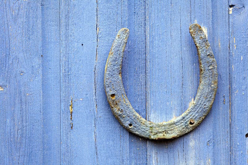 Old horseshoe on nail stock photo. Image of rusty, nail - 5356898