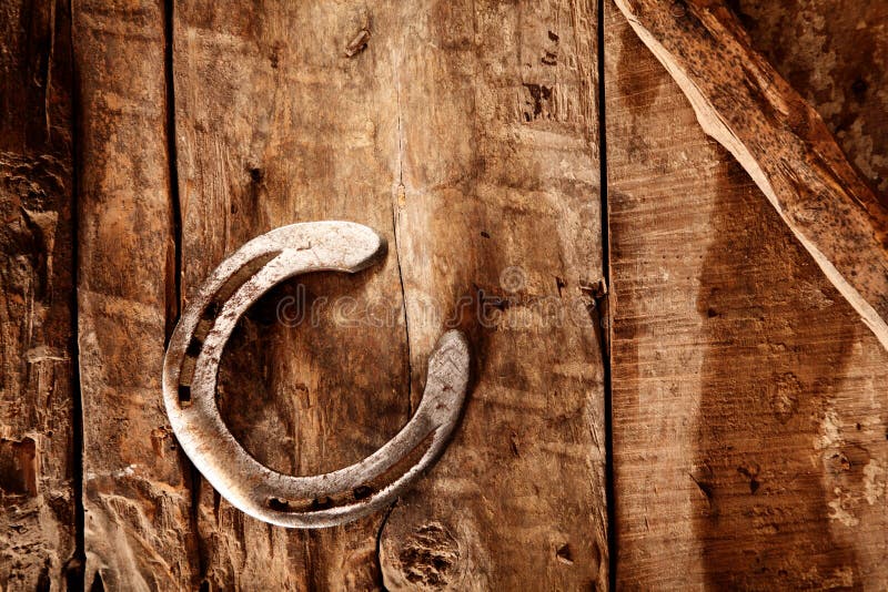 Lucky horseshoe on a rustic wood background