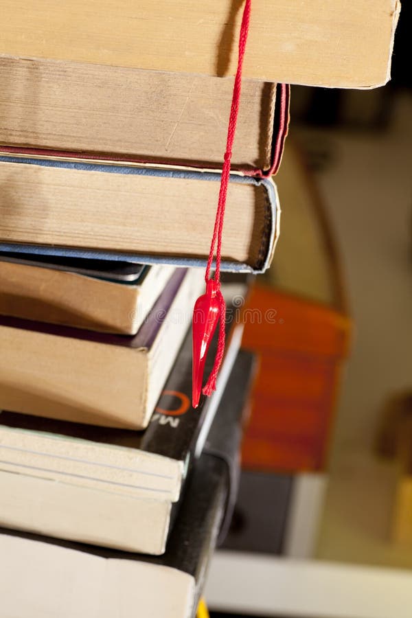 Lucky rabbit's foot, bookmark and books stock photo