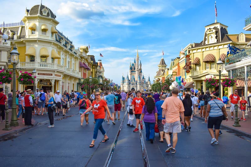 Orlando, Florida. March 19, 2019. People walking in Main street at Magic Kingdom in Walt Disney World   1. Orlando, Florida. March 19, 2019. People walking in Main street at Magic Kingdom in Walt Disney World   1