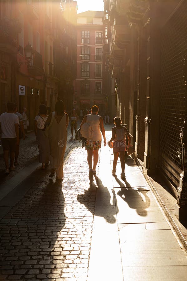 Bilbao,Spain - August 02,2022: People walking in the downtown of Bilbao in a sunny day. Bilbao,Spain - August 02,2022: People walking in the downtown of Bilbao in a sunny day