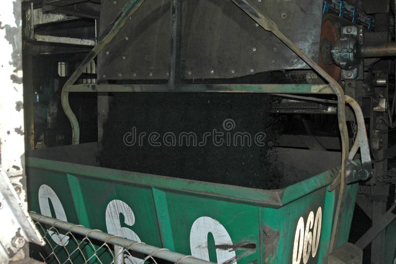 Aerial bucket filling up with coal at Stockton Coal Mine, West Coast, South Island, New Zealand. Aerial bucket filling up with coal at Stockton Coal Mine, West Coast, South Island, New Zealand