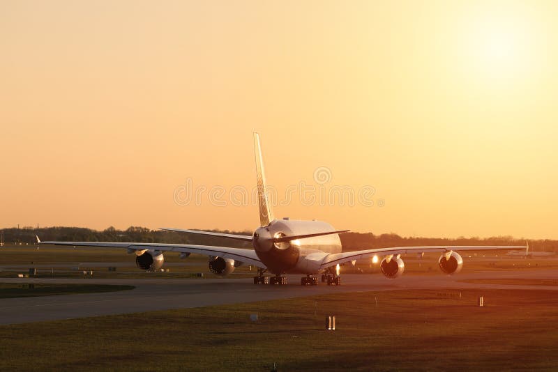 Lufthansa plane at sunset, orange light royalty free stock photos