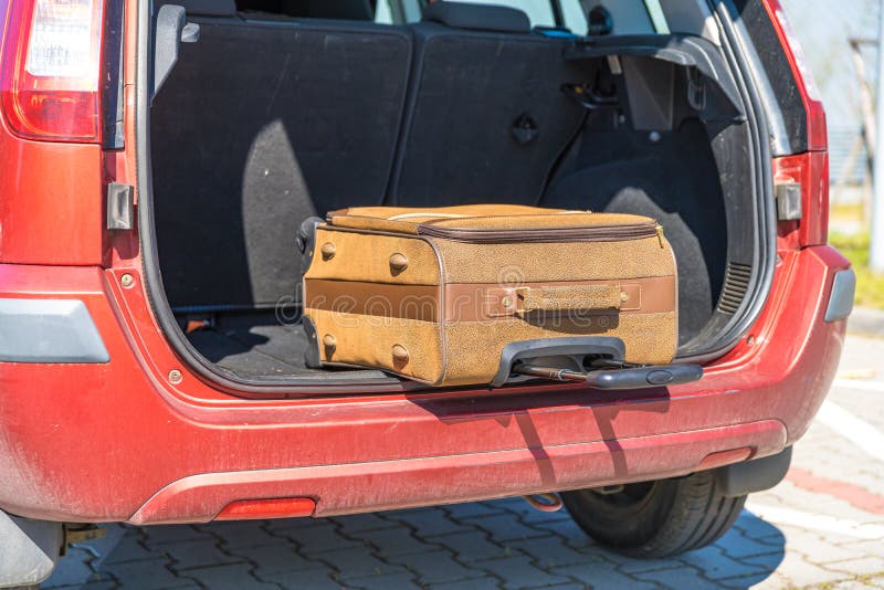 Car with Luggage in Trunk on Snowy Road. Winter Vacation Stock Image