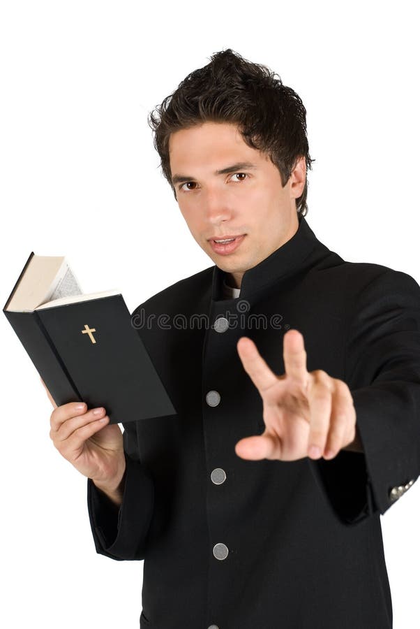 Young priest reading from bible and talking with you gesturing same time to listen him or showing peace sign,focus on his face,isolated on white background,check also. Young priest reading from bible and talking with you gesturing same time to listen him or showing peace sign,focus on his face,isolated on white background,check also