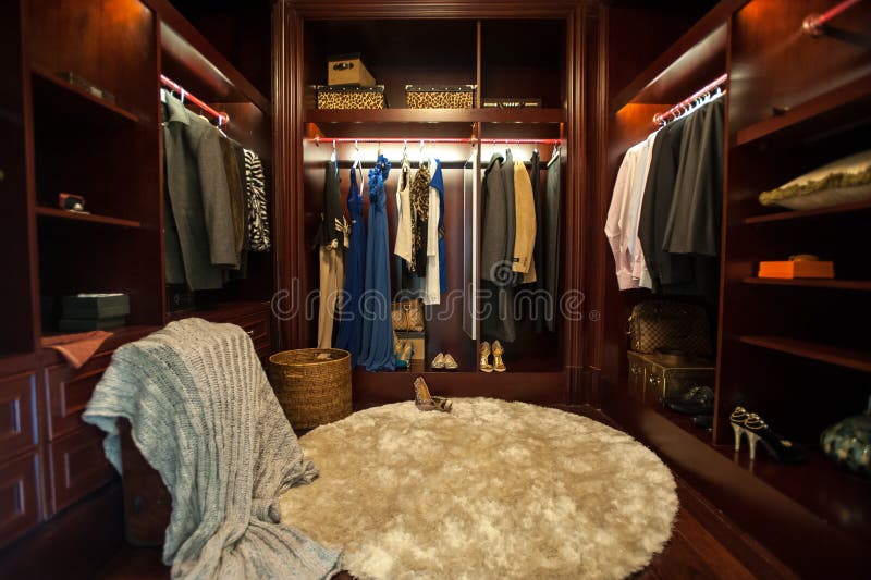 A dark wood decorated luxury closet in a villa. A dark wood decorated luxury closet in a villa.