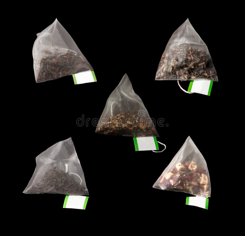 5Luxury teabags isolated on black with label in Pyramid teabag. 5Luxury teabags isolated on black with label in Pyramid teabag