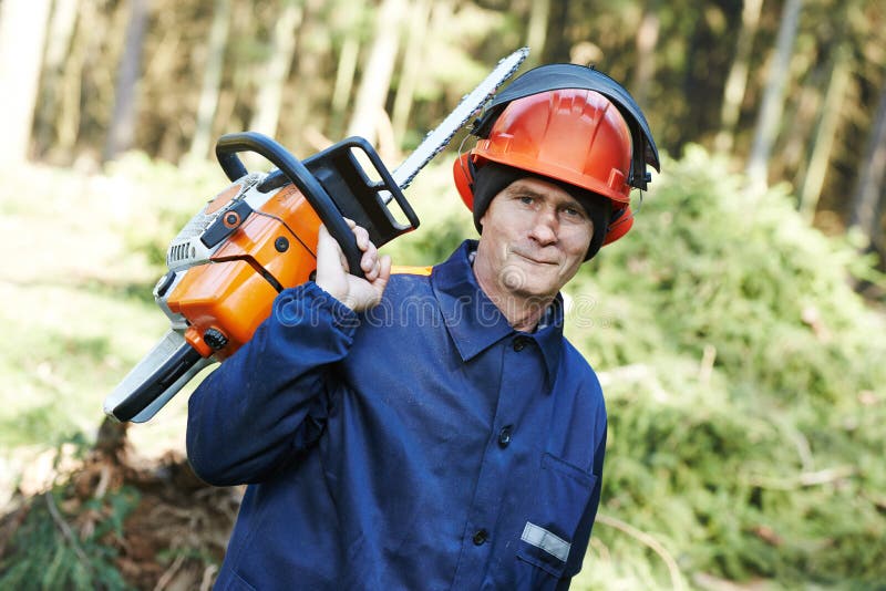 Lumberjack Worker with Chainsaw in the Forest Stock Image Image of