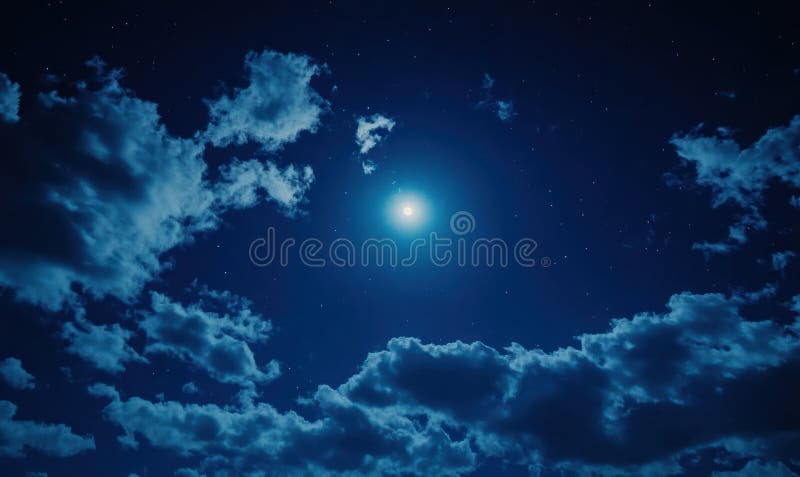A luminous full moon surrounded by a clear starry night sky with soft, scattered clouds creating a serene and tranquil royalty free stock image