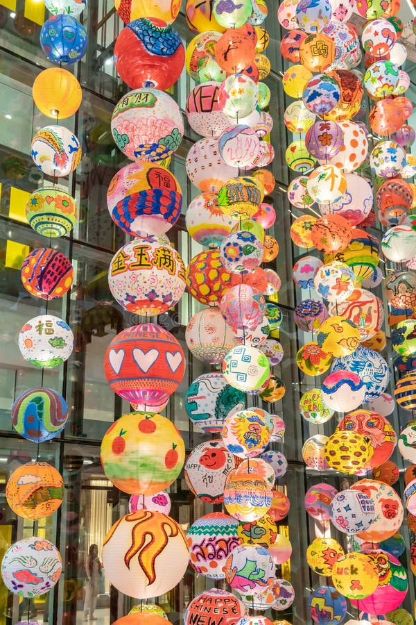 Lunar new year decoration with strings of colorful hand drawn lanterns hanging from ceiling to celebrate Chinese new year stock photo Lunar new year decoration with strings of colorful hand drawn lanterns hanging from ceiling to celebrate Chinese new year stock photo
