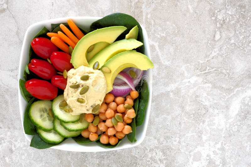 Lunch bowl with fresh vegetables and hummus