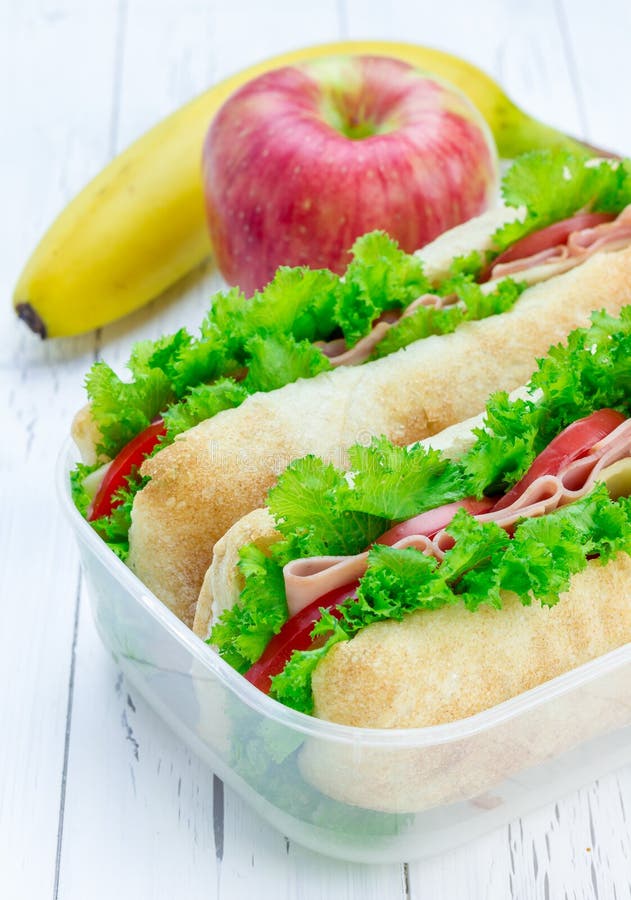 Lunch Box with Ciabatta Bread Sandwiches, Apple, Banana Stock Photo Image of cheese, lettuce