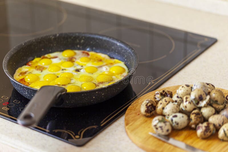 Lunch, Breakfast, Fried Eggs from Quail Eggs Fried in a Pan Stock Photo