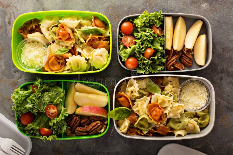 Lunch boxes with food ready to go for work or school, ahead meal preparation or dieting concept. Lunch boxes with food ready to go for work or school, ahead meal preparation or dieting concept