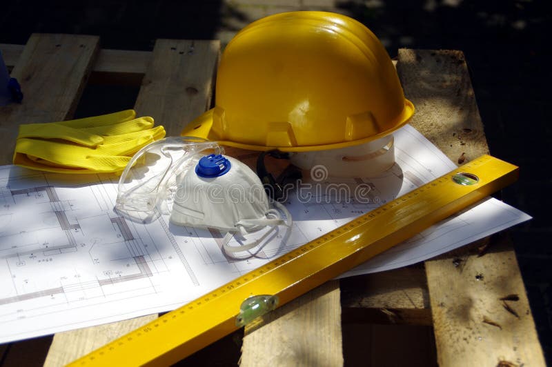 Helmet, goggles, mask and gloves. Personal protective equipment on construction site. Heavy industry business. Helmet, goggles, mask and gloves. Personal protective equipment on construction site. Heavy industry business