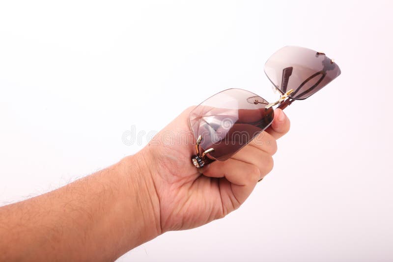 Lunettes de soleil de prise de main photos stock Lunettes de soleil de prise de main photos stock