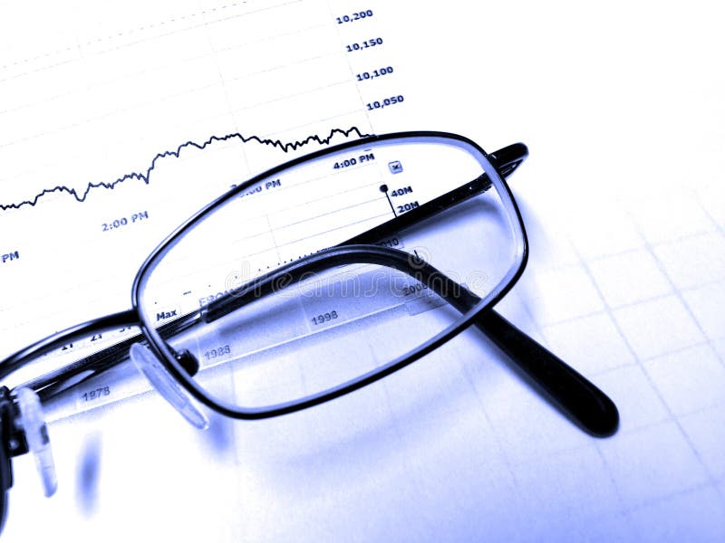 Closeup of Eyeglasses with stock chart Background. Closeup of Eyeglasses with stock chart Background