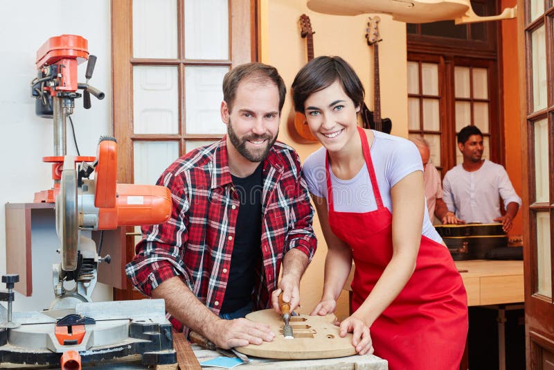 Wood Working Luthier Building a Guitar in His Stock Photo