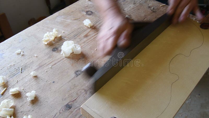 Luthier manufacturing the cover of a new violin or viola