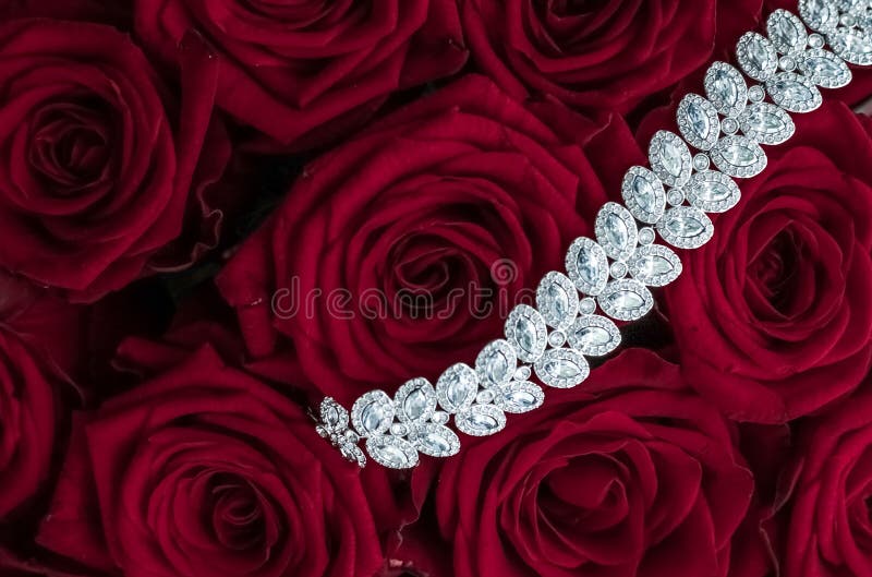 Luxe branding, glamour fashion and boutique shopping concept - Luxury diamond jewelry bracelet and red roses flowers, love gift on Valentines Day and jewellery brand holiday background design