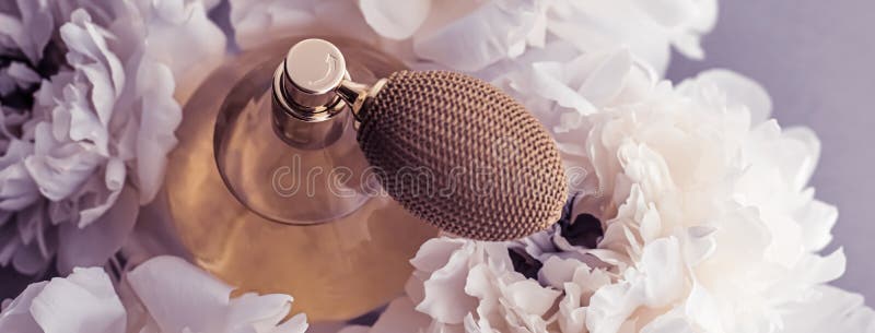 Violet Fragrance Bottle As Luxury Perfume Product On Background Of Peony  Flowers, Parfum Ad And Beauty Branding Design Stock Photo, Picture and  Royalty Free Image. Image 149590294.