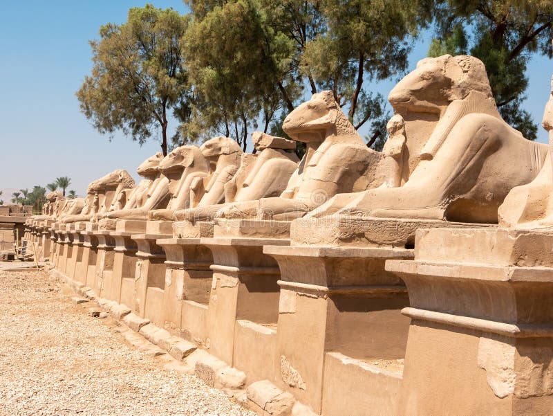 Luxor, Egypt - October 3, 2021: Alley of the Sphinxes at Karnak Temple. Ancient Egyptian statues are set in a row