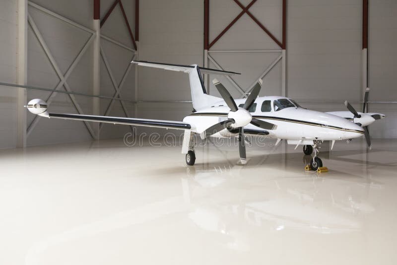 Luxurious aircraft in a big hangar