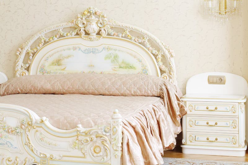 Luxury Bedroom in Light Colors with Golden Furniture Details. Big