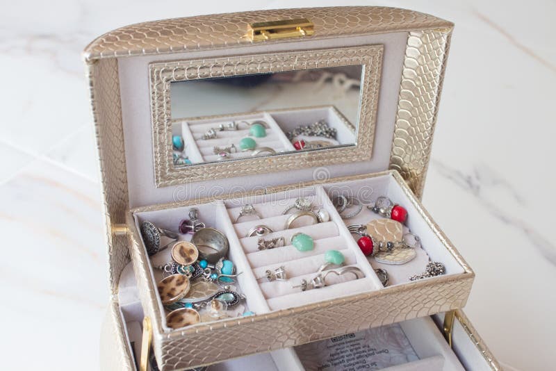 Luxurious casket with drawers and silver jewelry, precious stones, pearls