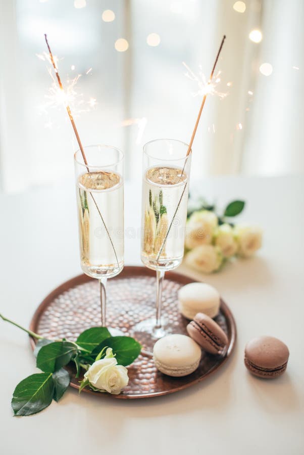 Luxurious champagne wedding party with white roses and macaron d