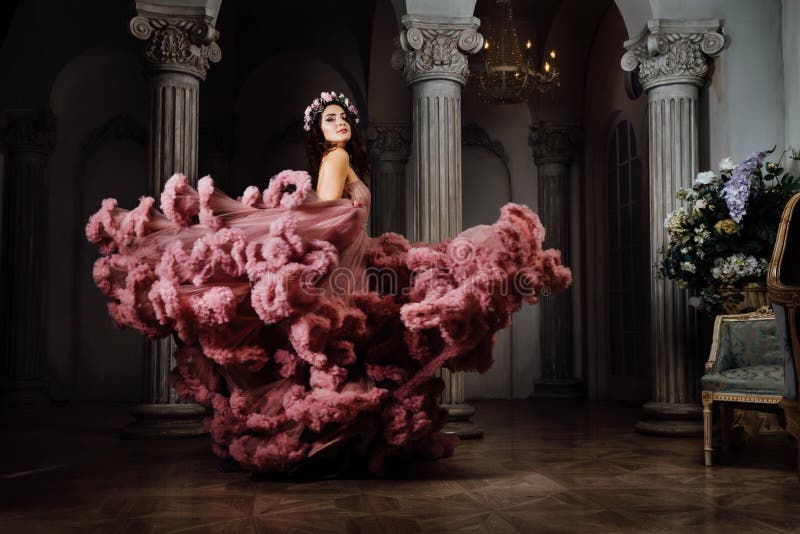 Luxurious girl in an evening cloudy dress dances and whirls at a ball stock photos Luxurious girl in an evening cloudy dress dances and whirls at a ball stock photos